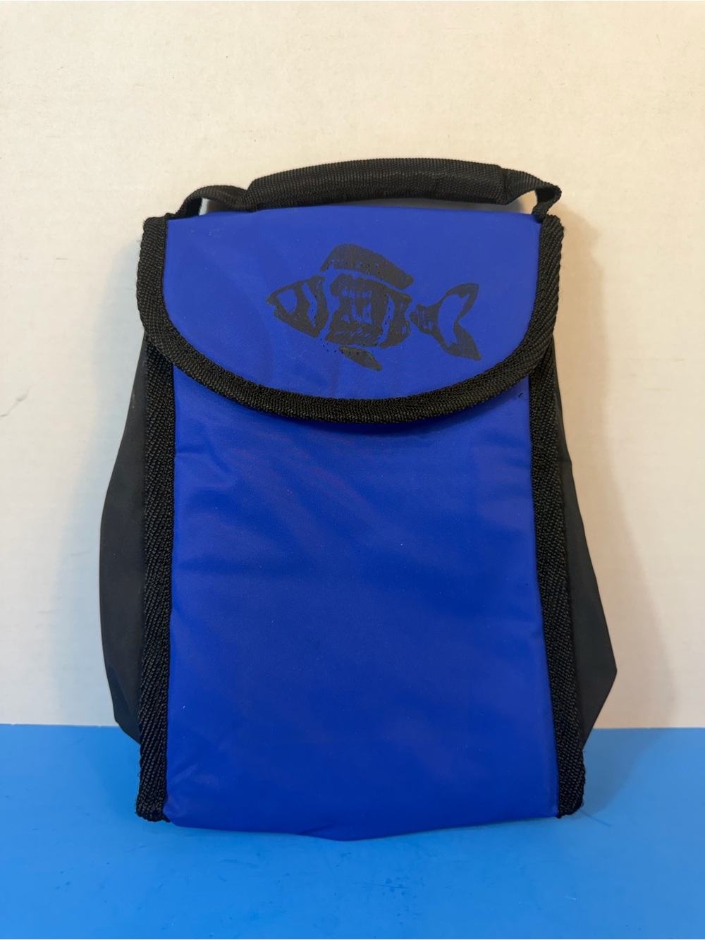small blue-and-black thermal bag (cooler bag) with a top handle